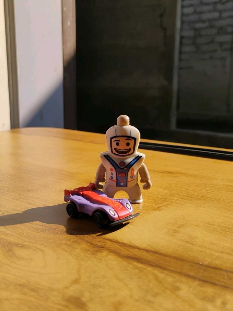 Toy Car and Spaceman Figurine