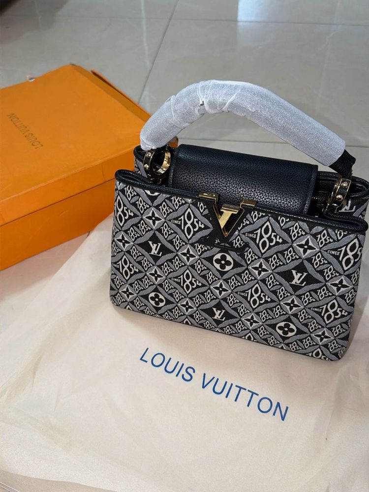 Louis Vuitton Capucine Handbag with sling belt