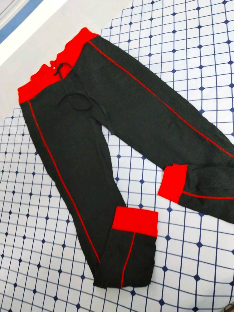 Black Payjama With Red Borders .