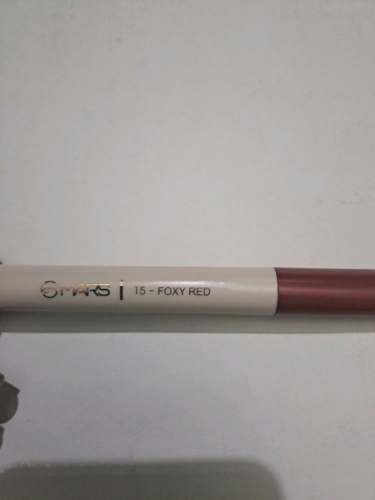 Gold Chain Necklace And Mars Lip Liner