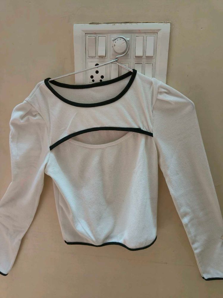 A white cut-out long sleeve crop top