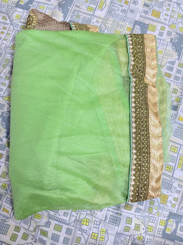 Lime Green Net Saree With Golden Trim