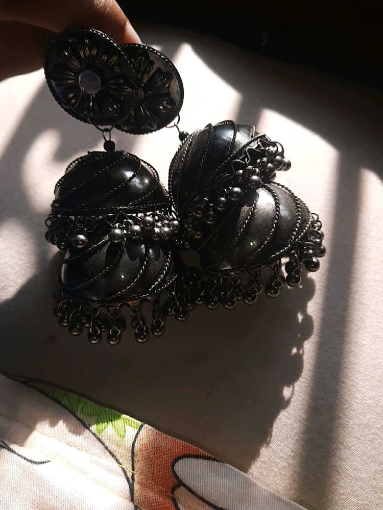 The black and big earring