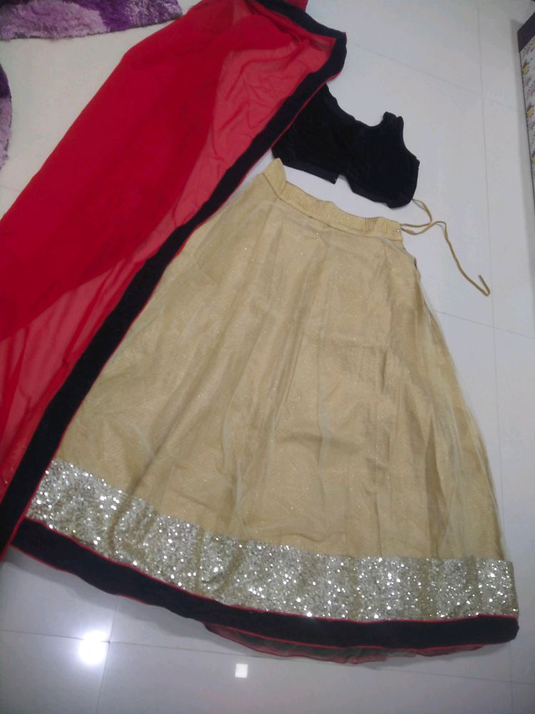 Off White Lehenga With Black Velvet Blouse And Contrast Red Chiffon Dupatta