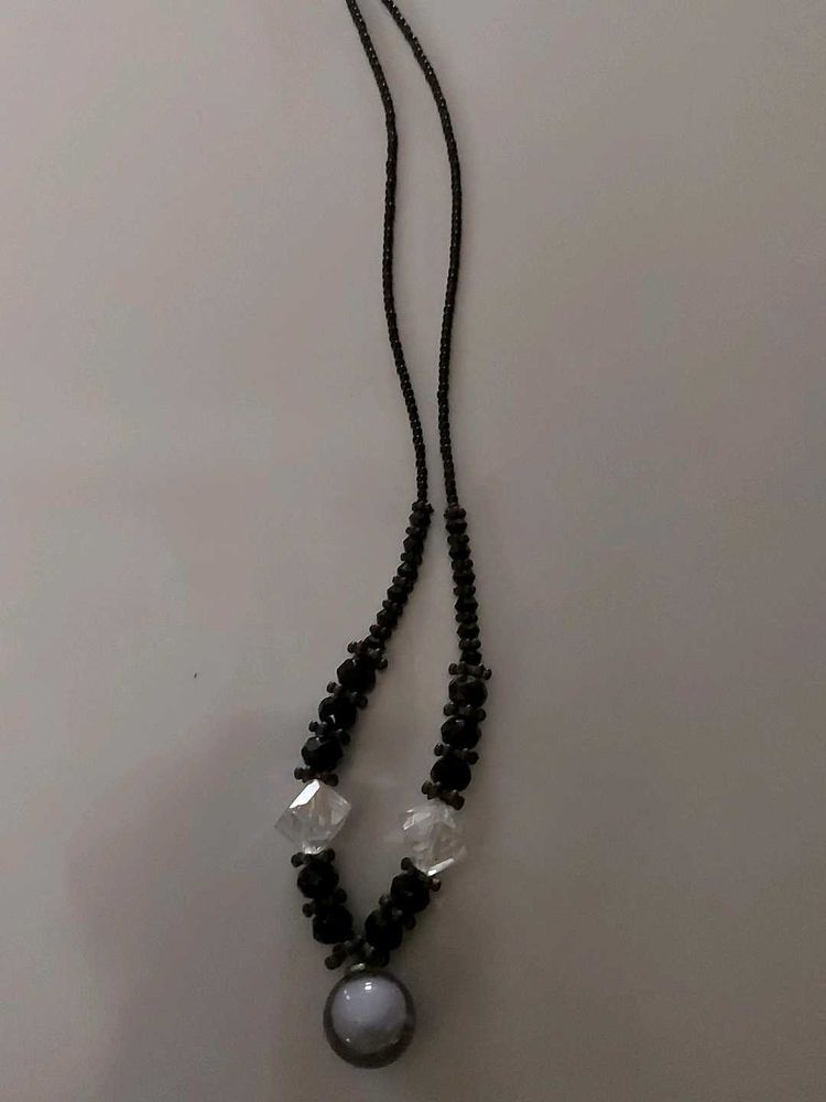 The necklace in th