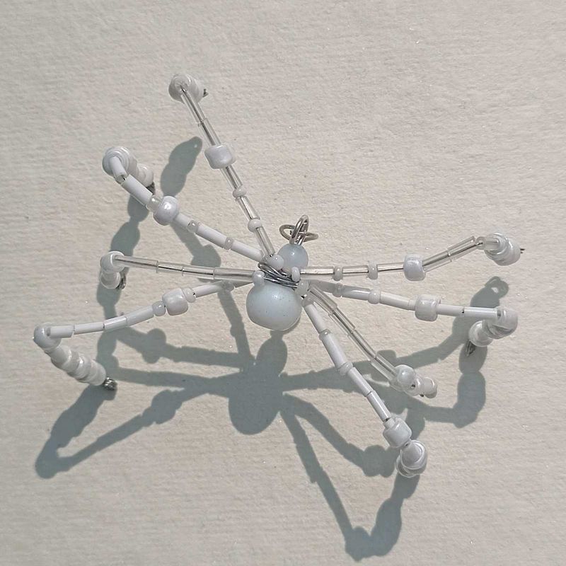 WHITE BEADED SPIDER CHARM