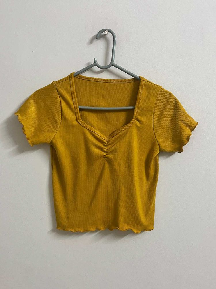 Title:Mustard Yellow Ribbed Lettuce Hem Crop Top
