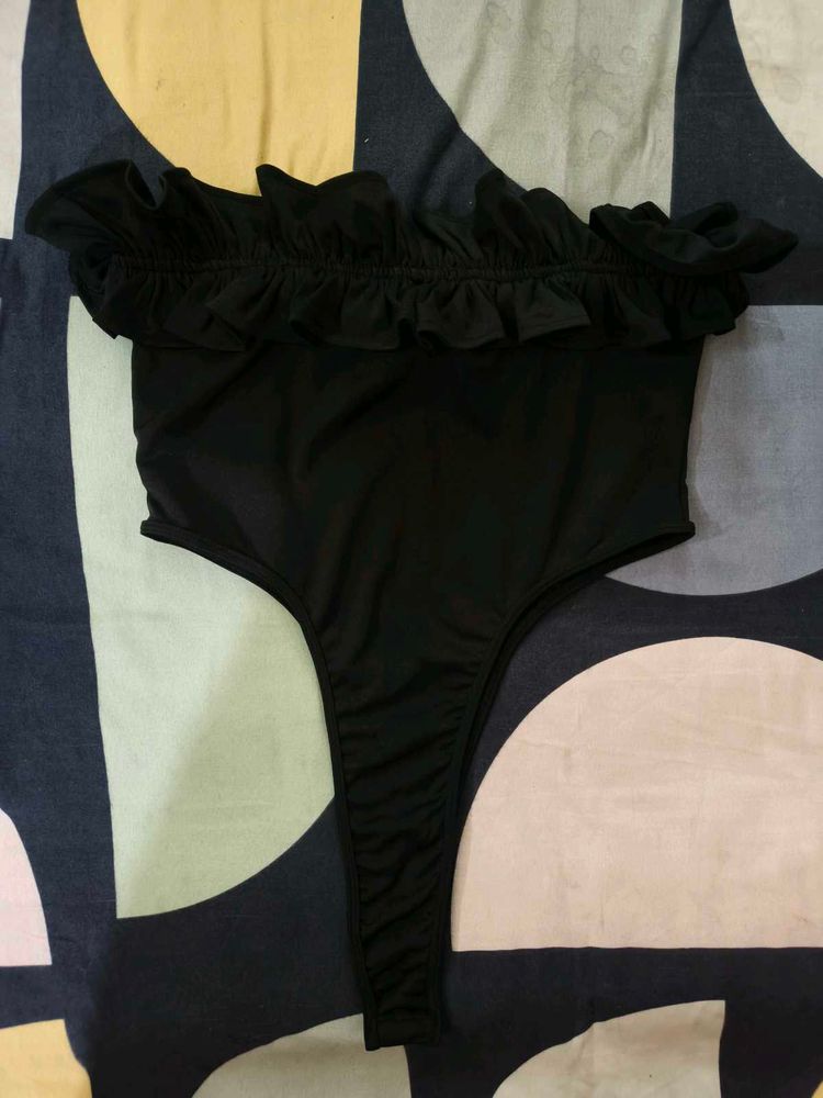 Black Ruffle Tube Bodysuit From NEWME