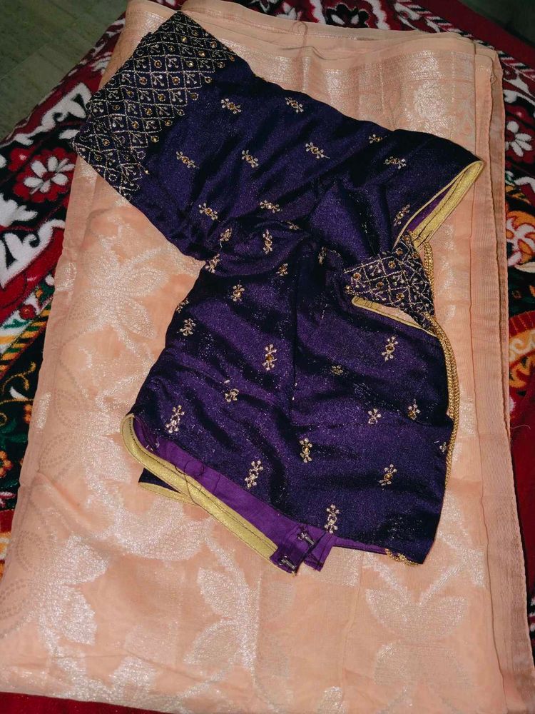 Crossandra saree with purple heavy blouse