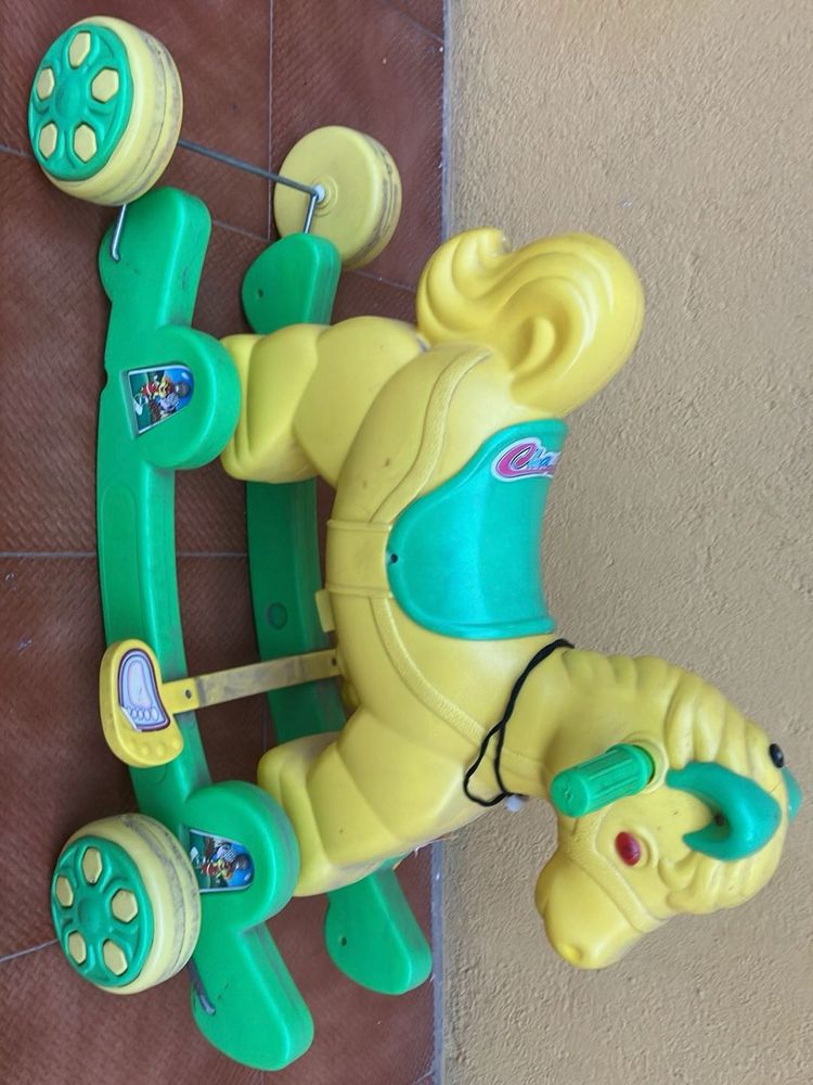 Toy Swing And Moving Kids Sitting Horse