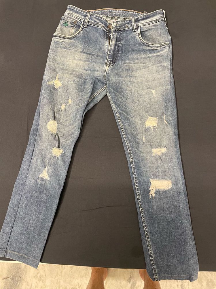 jeans in the photo have a distressed, ripped s