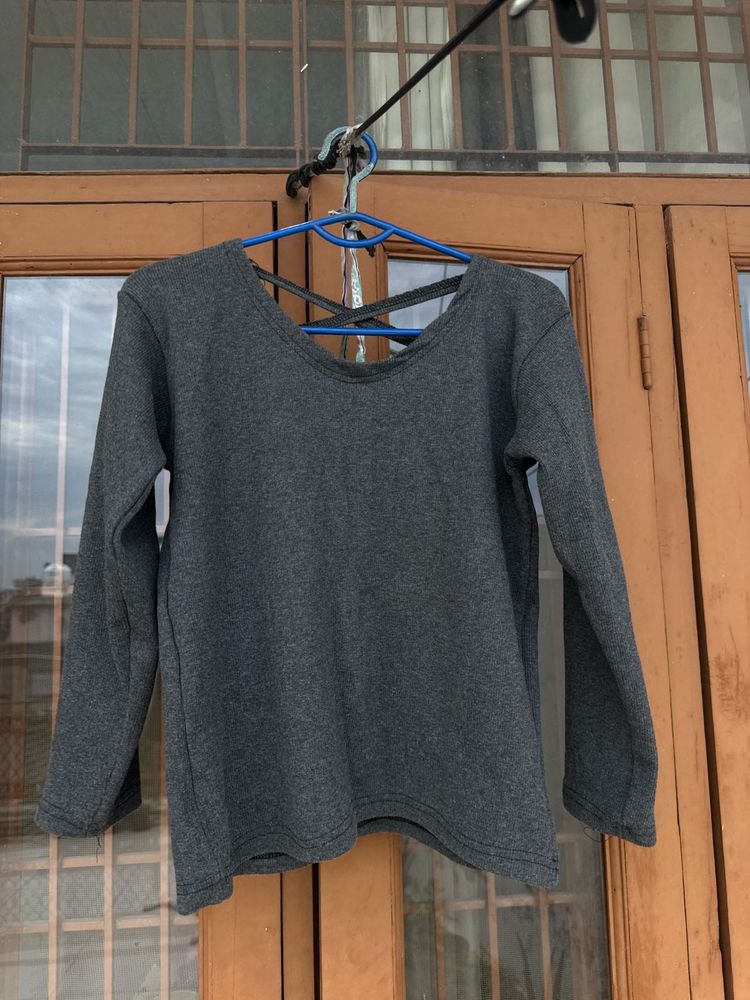 Combo of olive jacket and grey strip back top