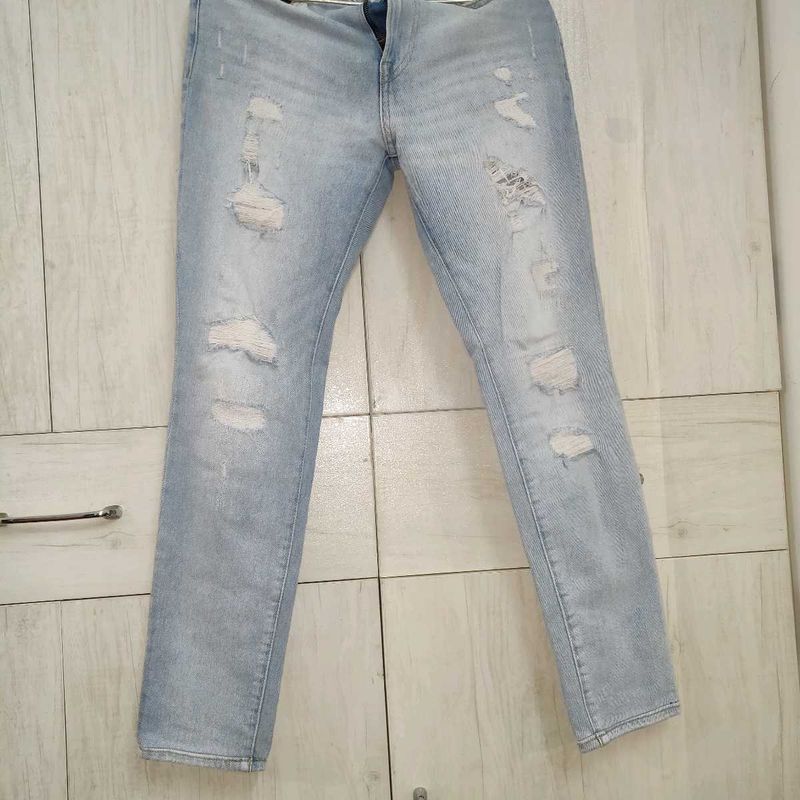 Light Blue Distressed Slim Fit Jeans.