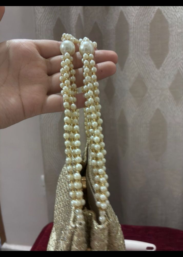 Elegant Gold Beaded Clutch