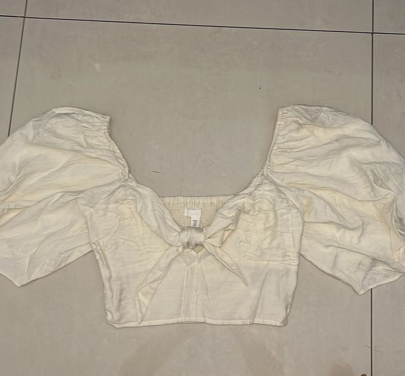 White puff sleeve tie-front top