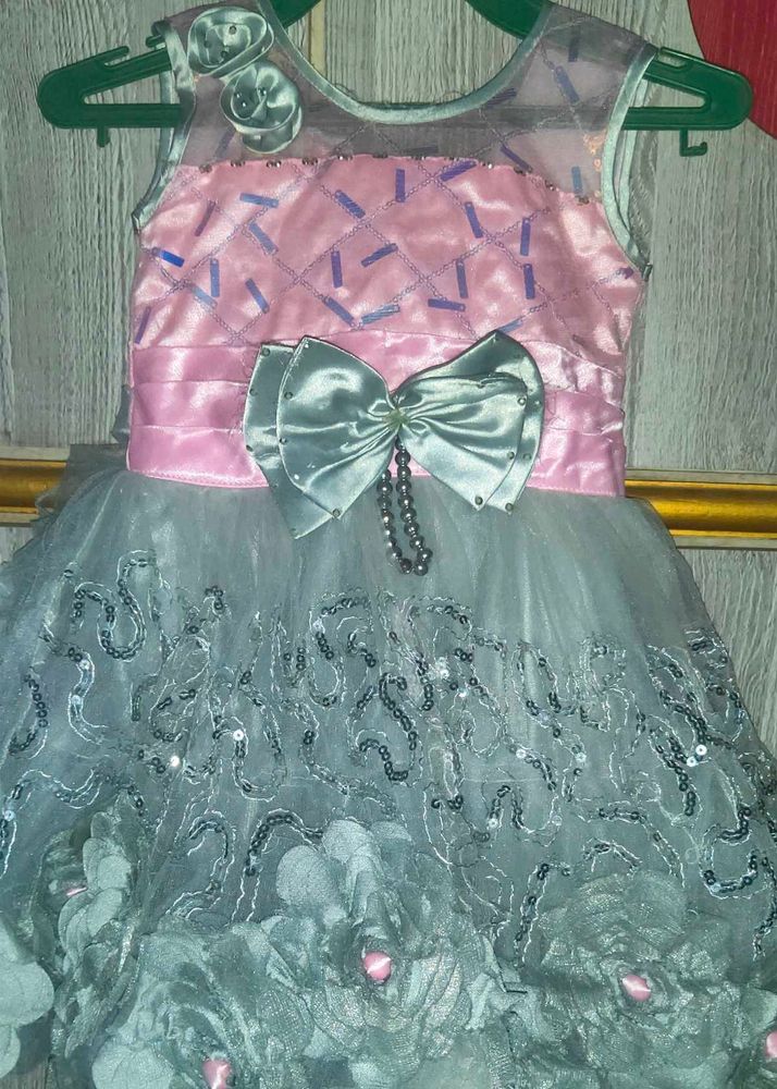 A Pink Frock With Cement Flowers