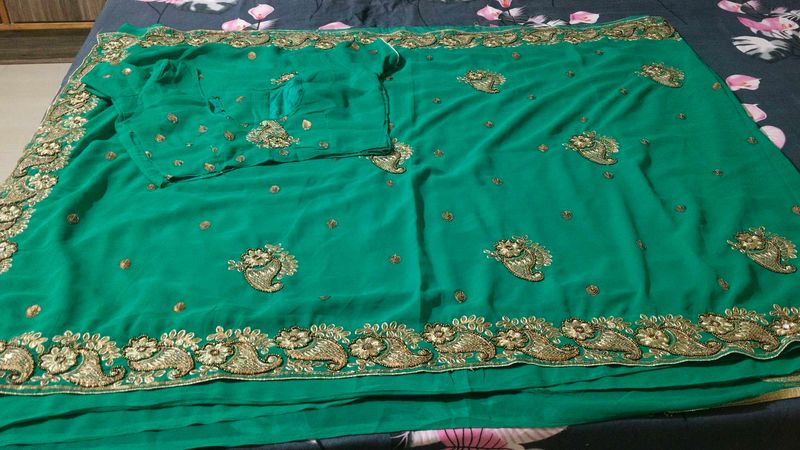 Elegant rama colour Embroidered Saree