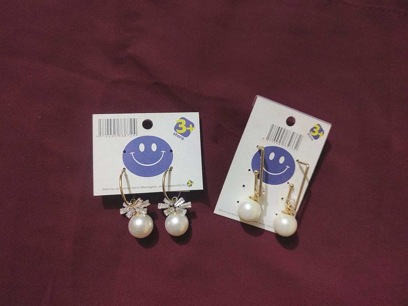 2 pair of gold plated pearl earrings with a stone