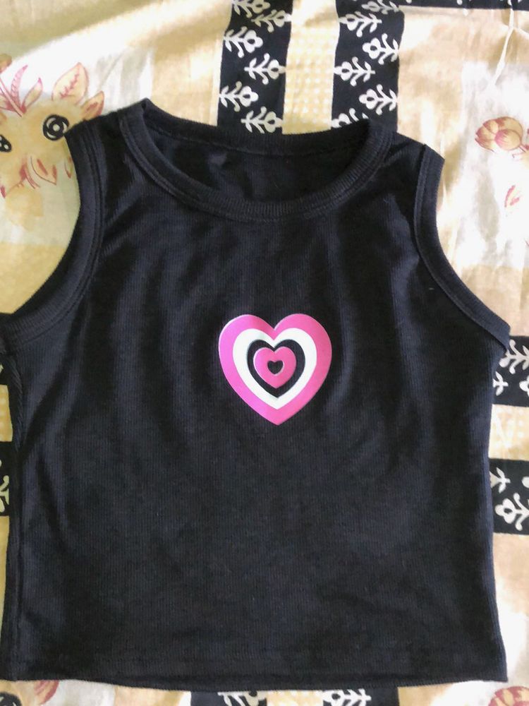 Black no sleeves crop top.