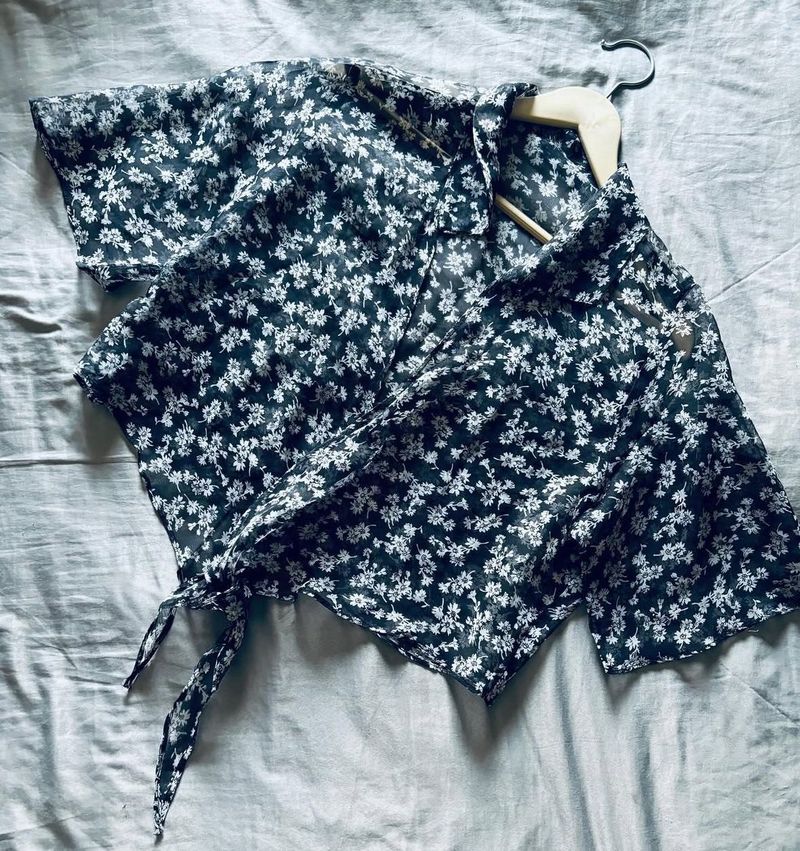 This is a floral print crop top.
