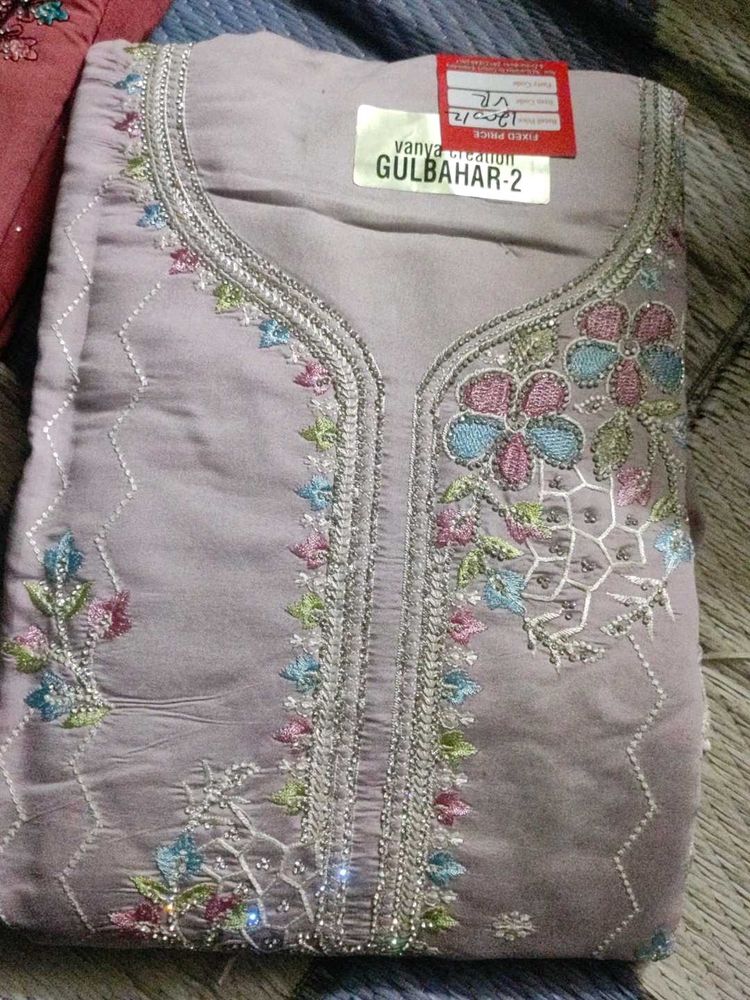 Unstitched Embroidered Dress Material
