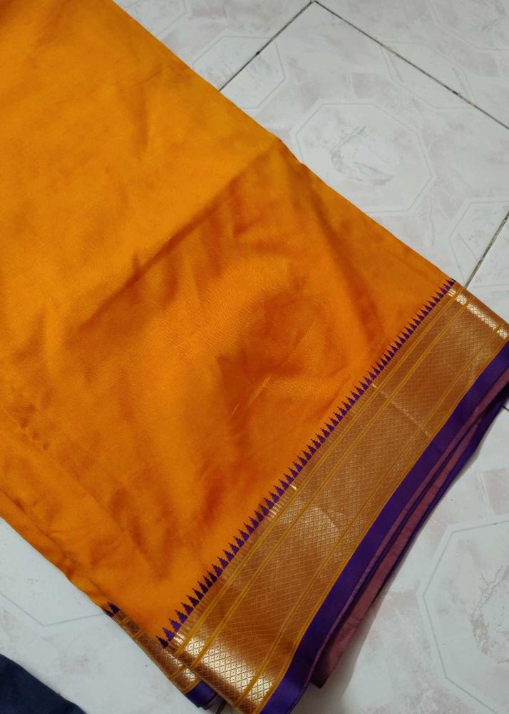 Mustard color saree with purple border and blouse