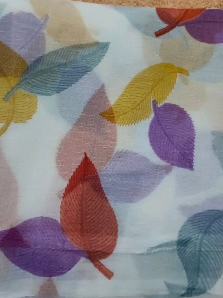 White Color Saree Colorfull Leaves Design. Georget Material.