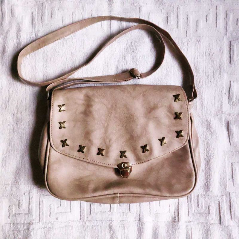 Cream Sling bag.