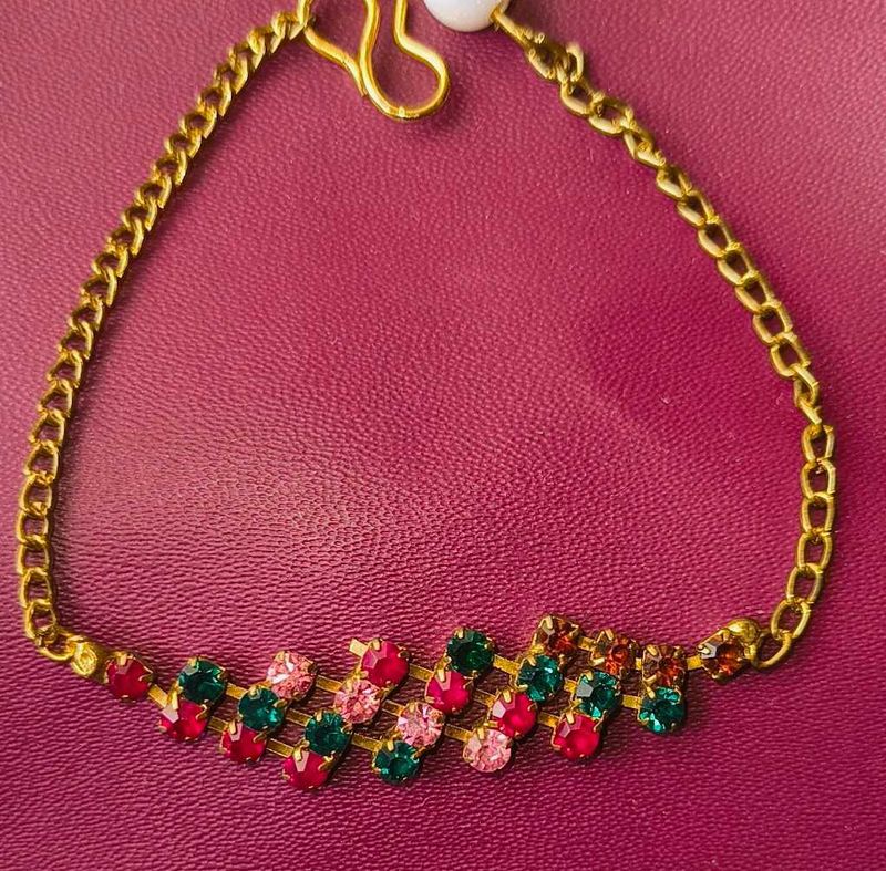 Gold Chained Bracelet With Rare Stones.