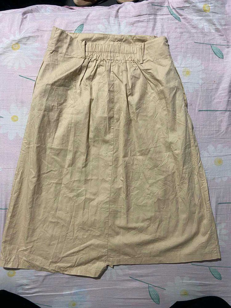 It Is a Cute Brown Skirt With Buttons