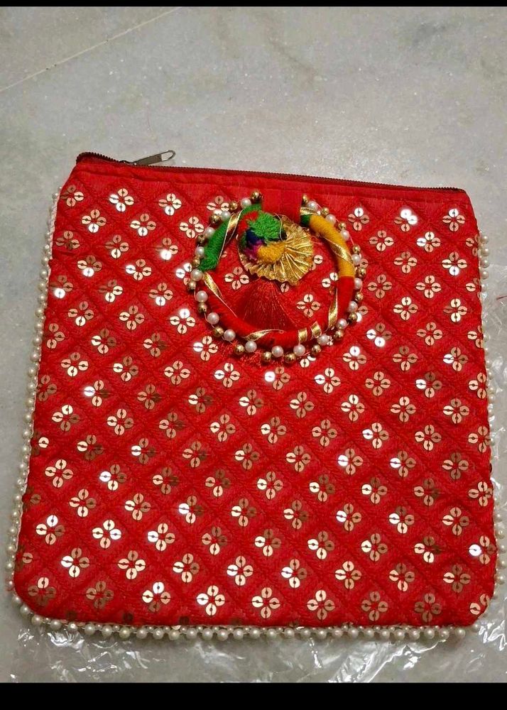 Red,rani pink, and purple Embroidered Clutches