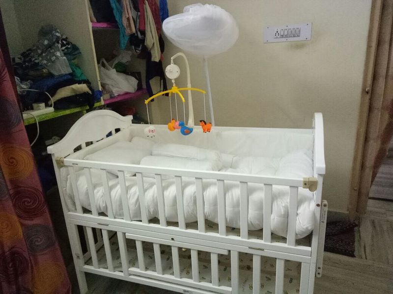 White Baby Crib with Mobile