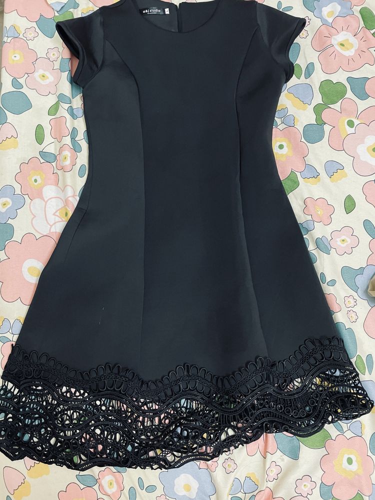 Chic Black Dress with Lace Hem