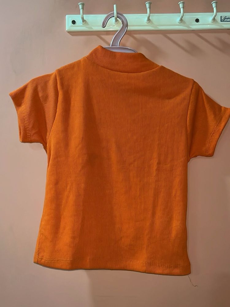 Orange Ribbed Mock Neck Top