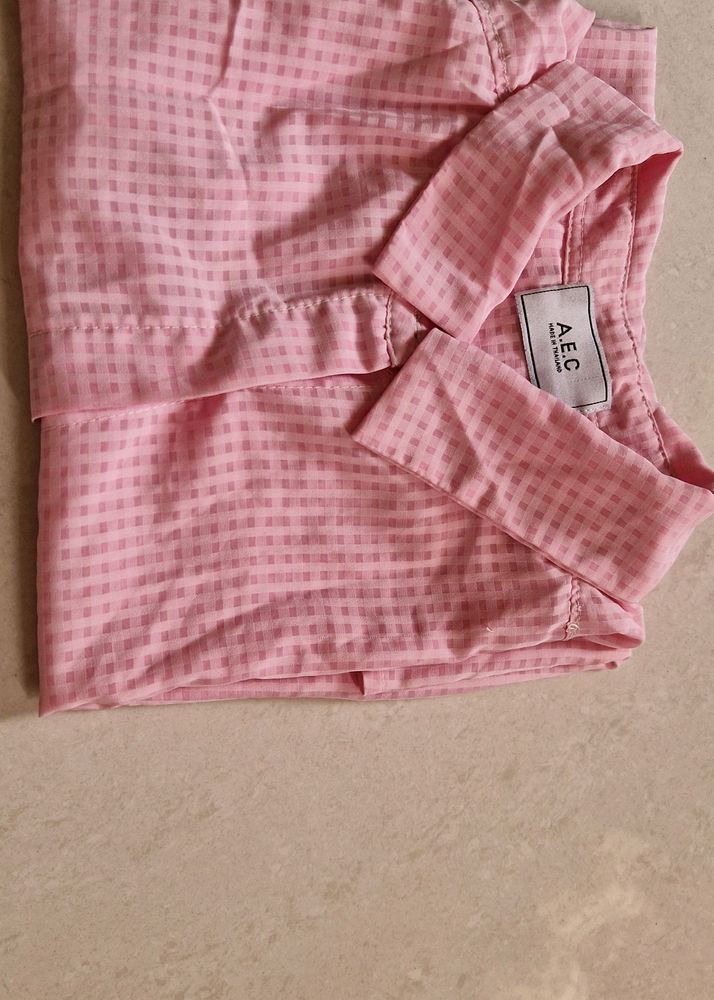 A Baby Pink Coloured Transparent Shirt.