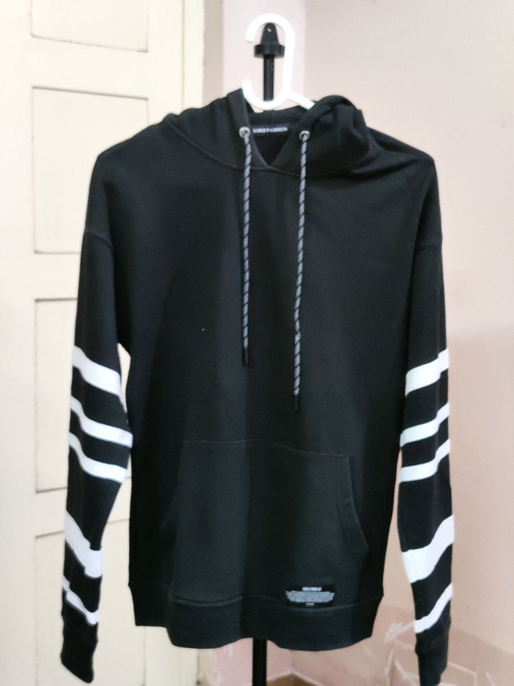 💥BUY1GET1💥 black hooded sweatshirt with white stripes on the sleeves.