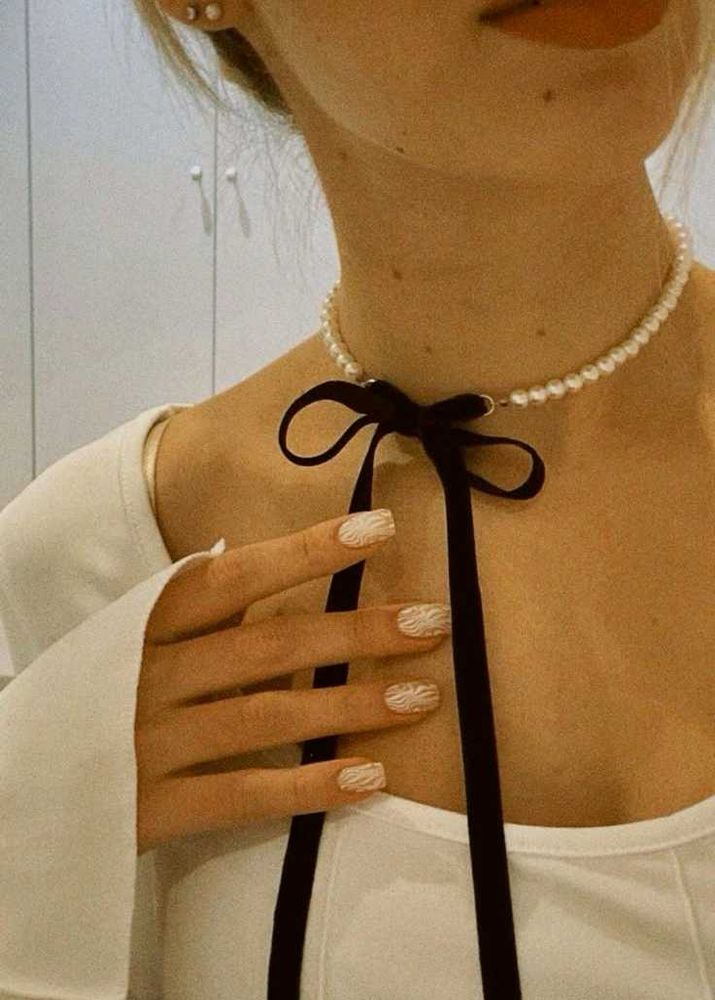Pearl choker with black ribbon