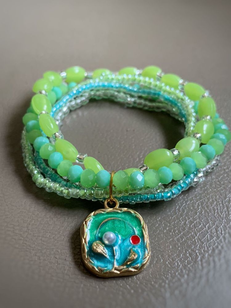 Green Beaded Bracelet with Floral Charm