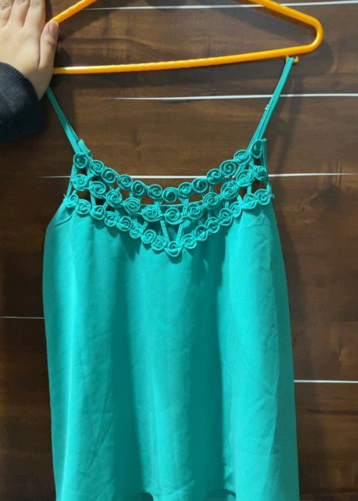 It Is A Teal Green Coloured Top Of Free Size.