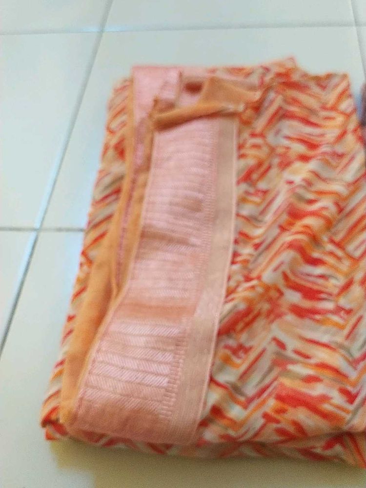 Elegant Orange Patterned Saree