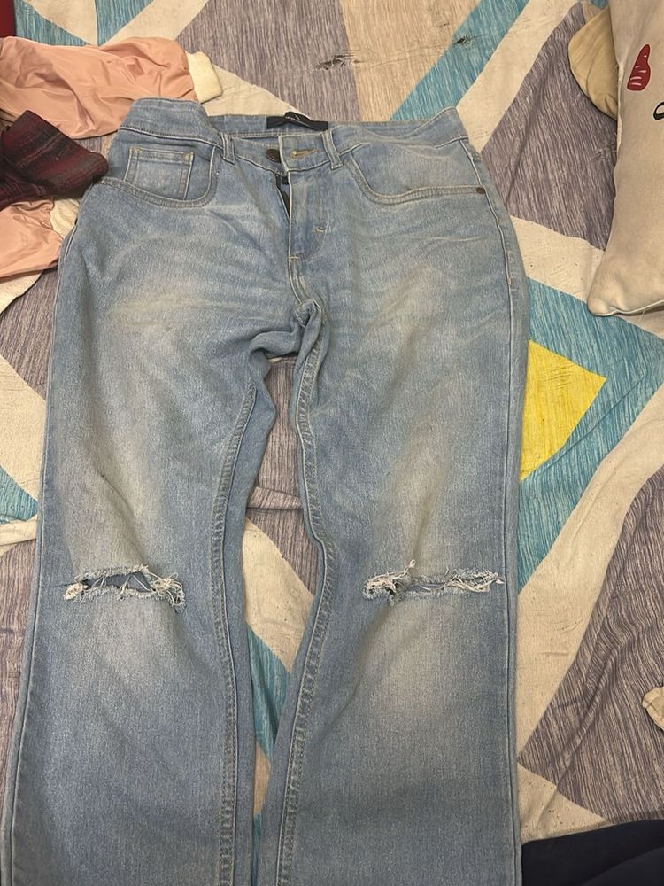 Ripped Light Wash Denim Jeans