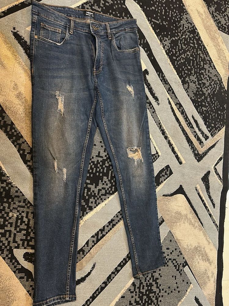 Distressed Denim Jeans