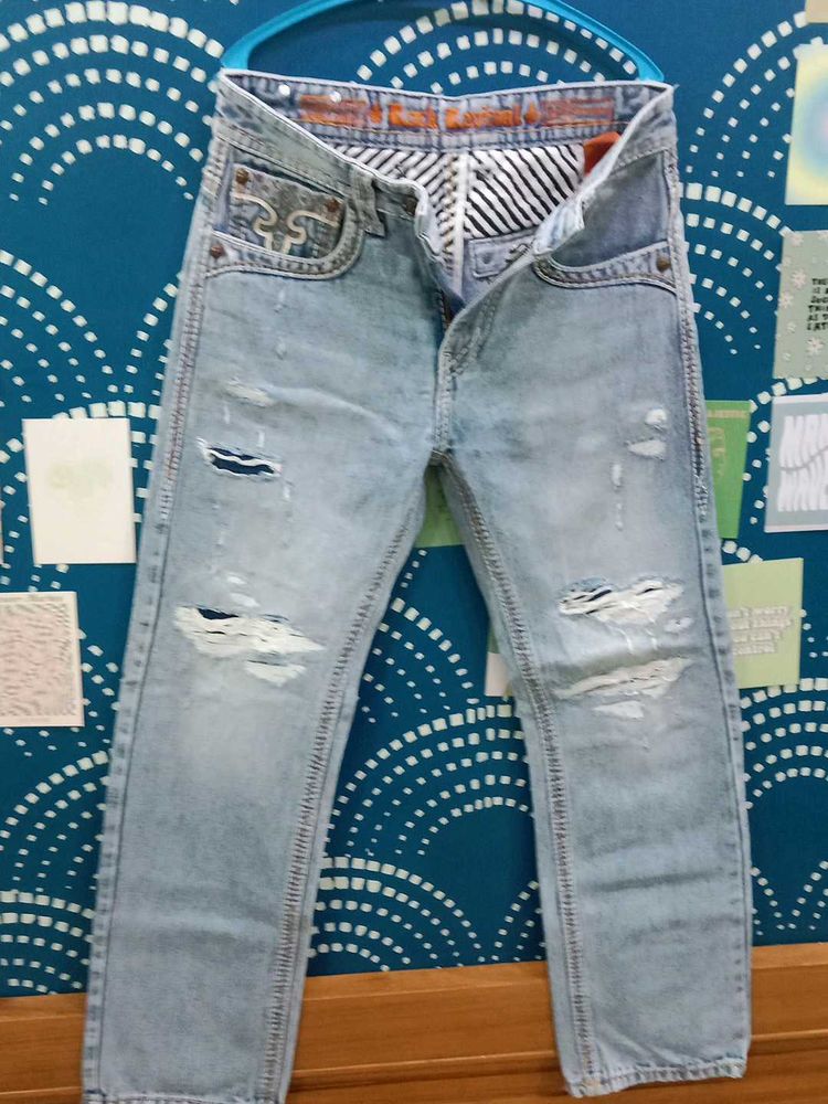 Ripped Light Wash Denim Jeans