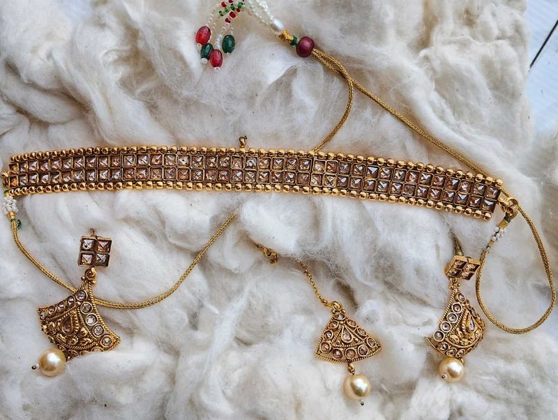 Gold-toned choker with earrings and headpiece
