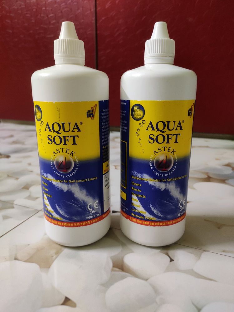 Two Large Bottles Of Aqua Soft Lens Water