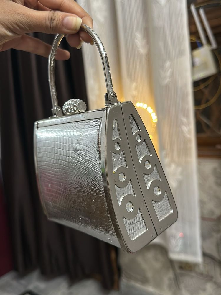 silver fancy hand bag all metal