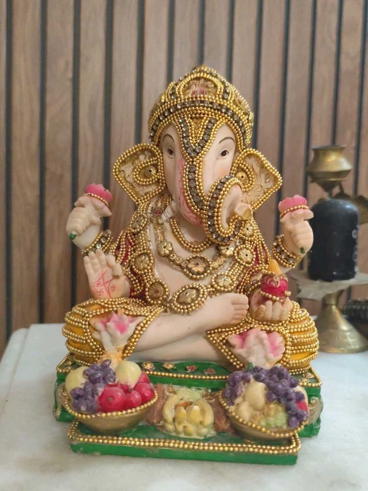 Ganesha Statue with Fruit Offerings