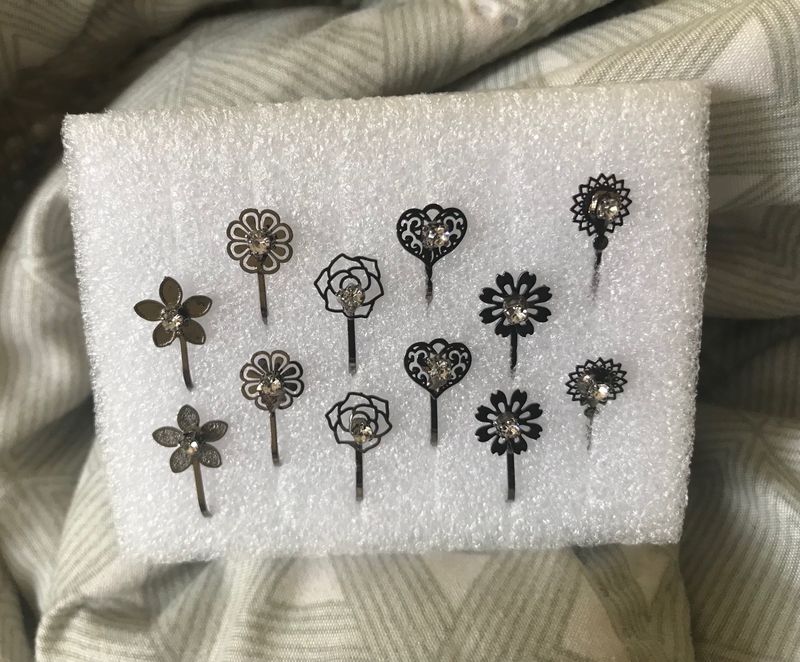 6 Pair Of Mini Nose Stud Or U Can Use It Like Mini Ear Stud.. No Piercing Required….. it’s Silver In Colour