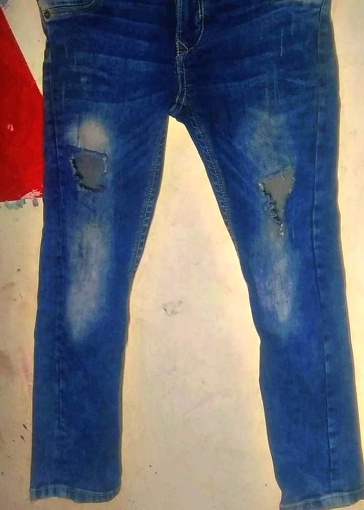 Ripped Blue Denim Jeans