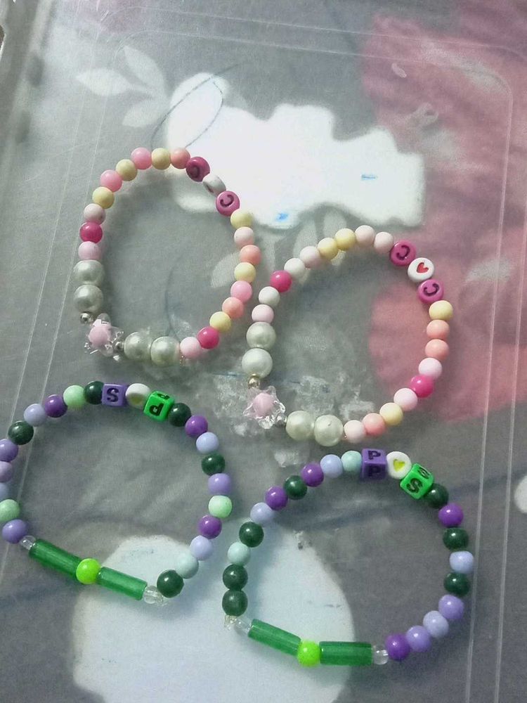 4 BRACELETS TWO PINK 2 GREEN POPULAR ITEMS